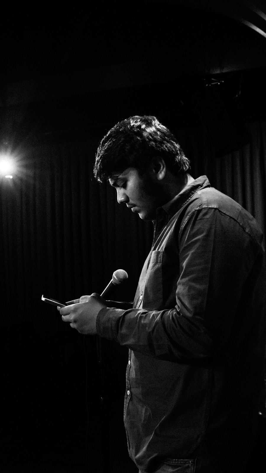 Comedian performing on stage